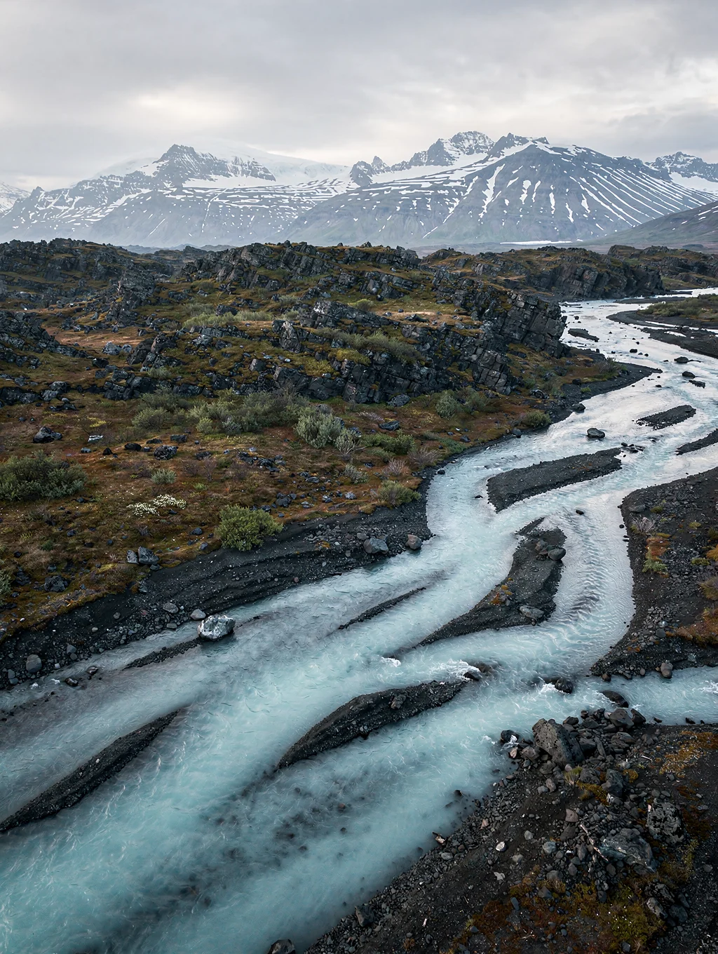 Braided glacial river flowing through alpine valley